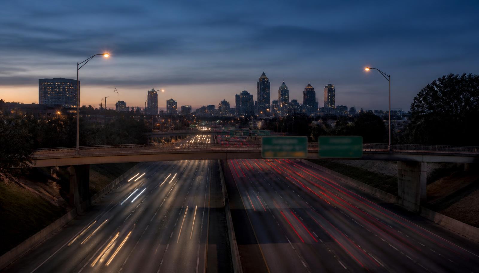 Atlanta interstate at dusk with the downtown skyline in the distance
